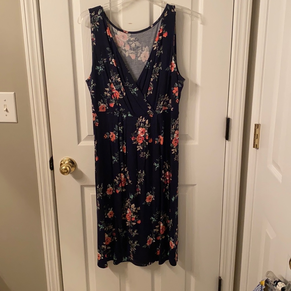 Sleeveless navy floral midi dress.